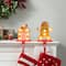 Glitzhome® Marquee LED Gingerbread House & Gingerbread Man Christmas Stocking Holder Set